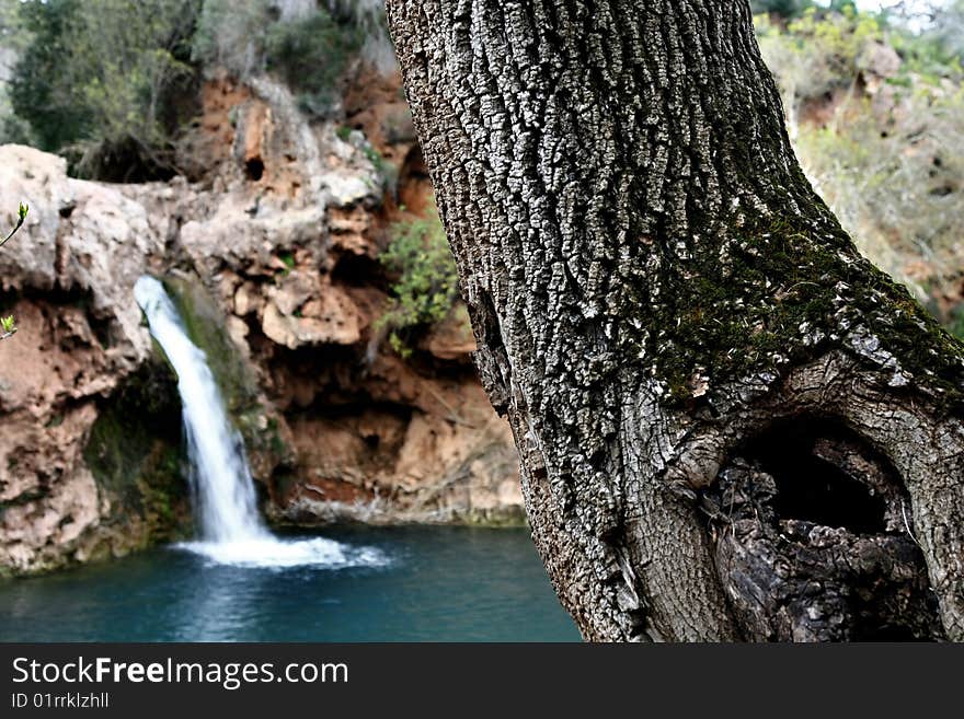 Beautiful waterfall with lake and wooden access located near Tavira, Portugal. Beautiful waterfall with lake and wooden access located near Tavira, Portugal.