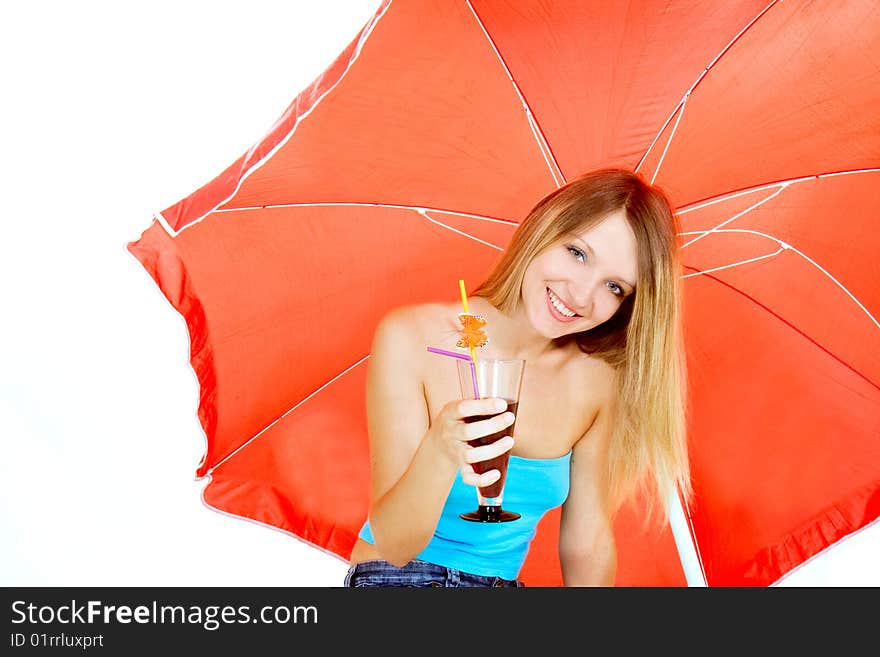 Attractive girl with glass of juice under red umbrella over white