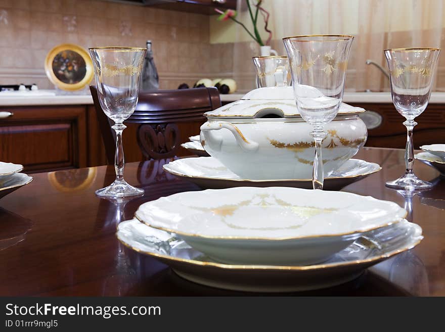 Glasses and plates on a wooden table