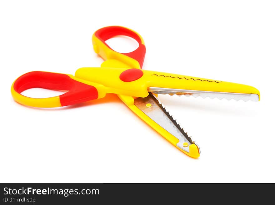 Modern yellow scissors on a white background