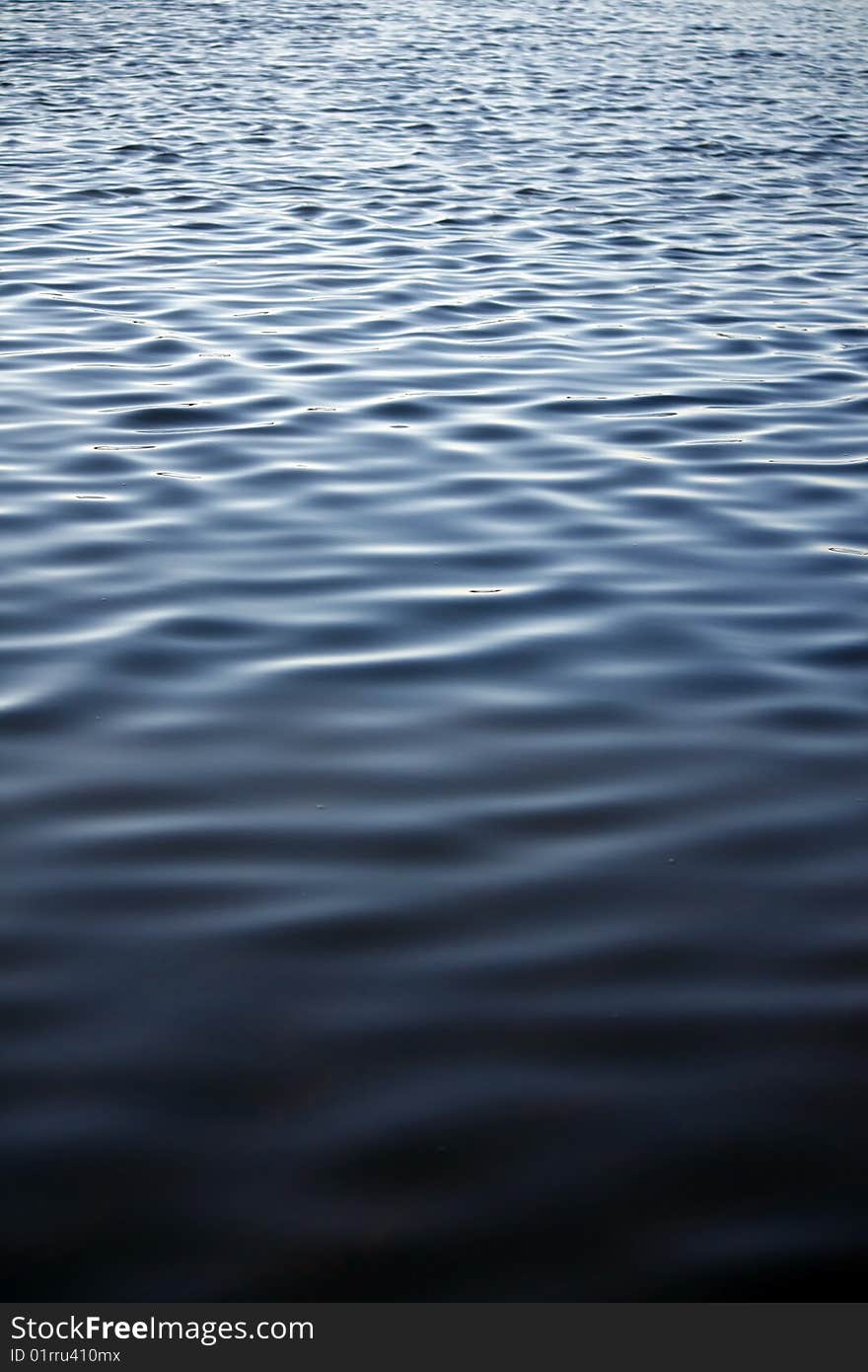 View of a part of the smooth ocean's waves. View of a part of the smooth ocean's waves.