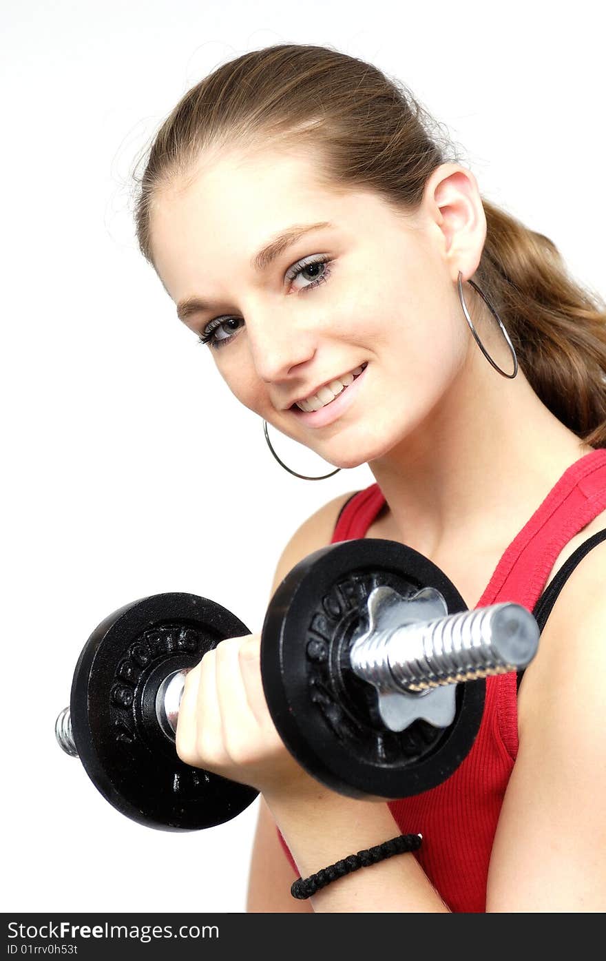 Young woman in red sport shirt with dumbbell. Young woman in red sport shirt with dumbbell