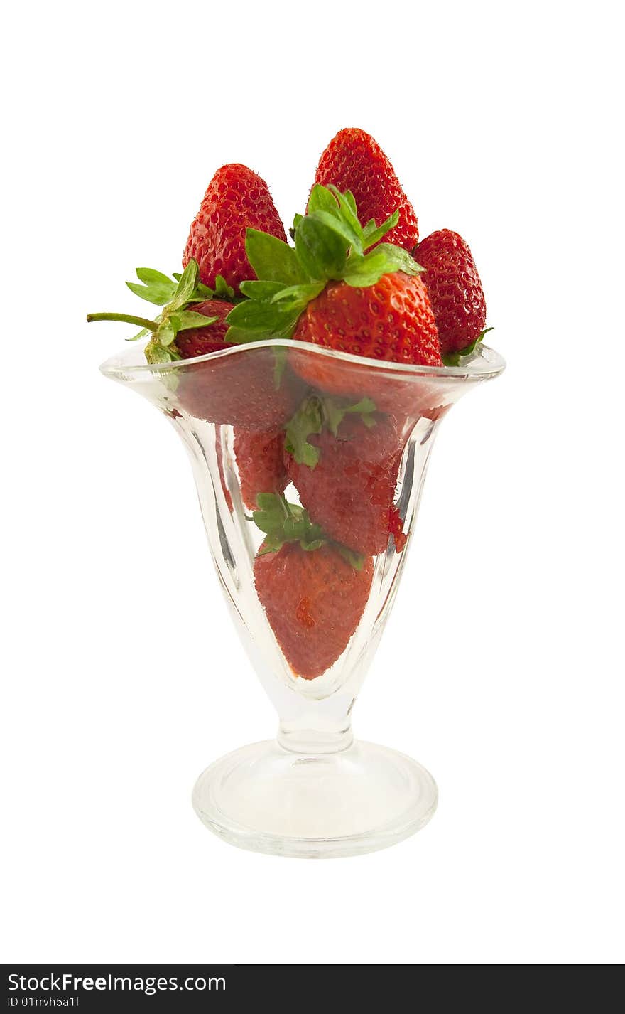 Fresh strawberry in a glass on a white background