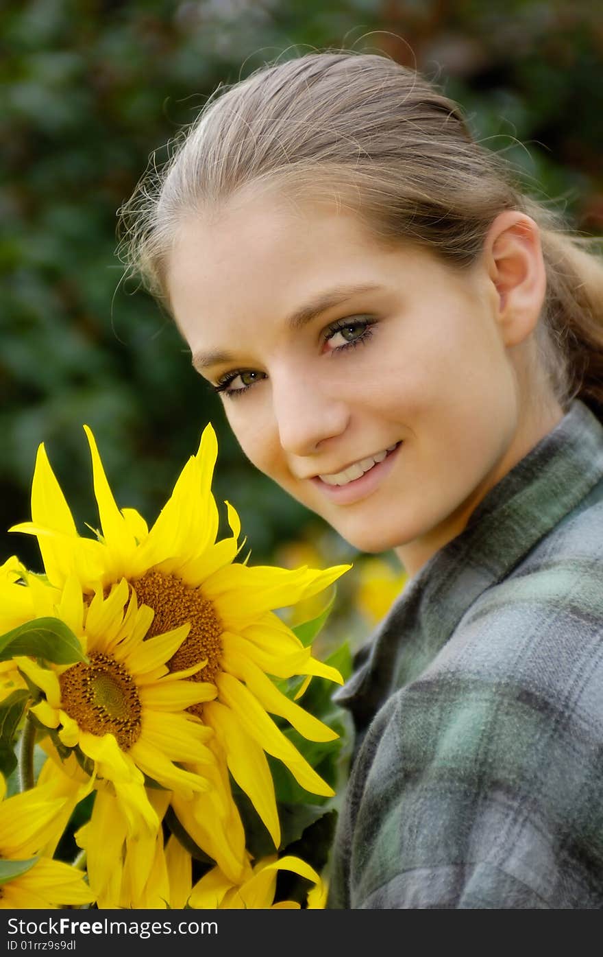 Young woman with sunflowers