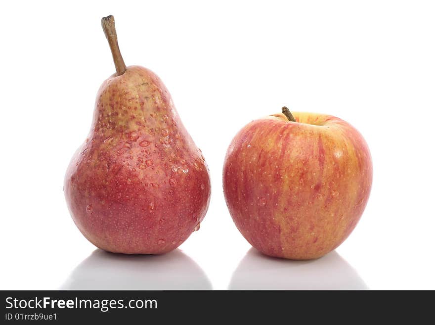 Red pear and apple isolated over white background. Red pear and apple isolated over white background