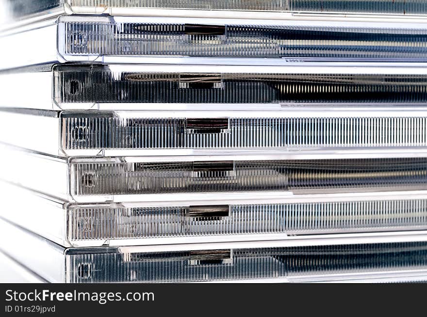 A horizontal image of a stack of CDs