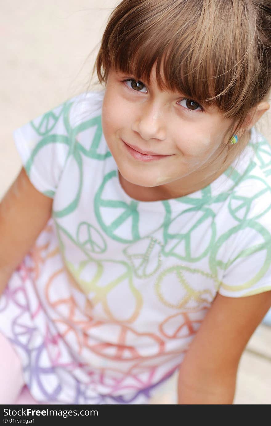 A cute girl with chalk on her face