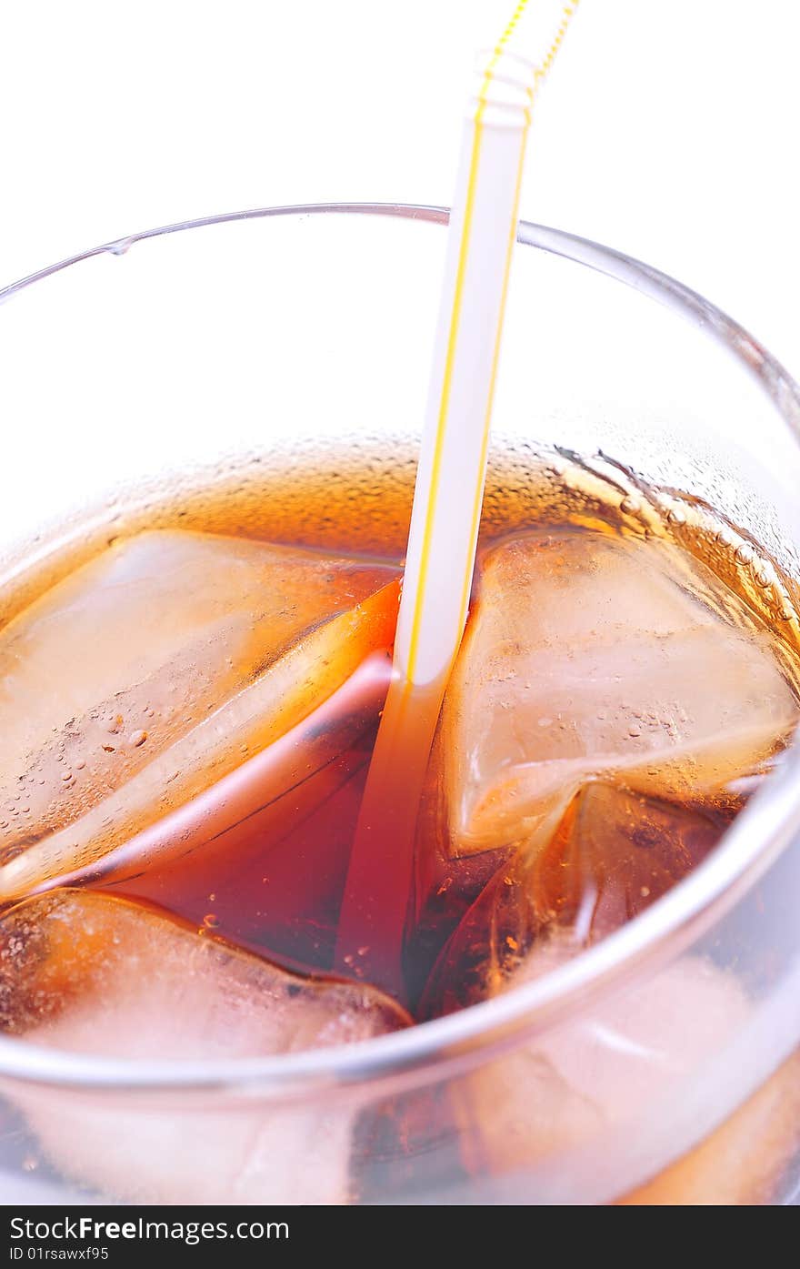 Glass of cola with ice cubes