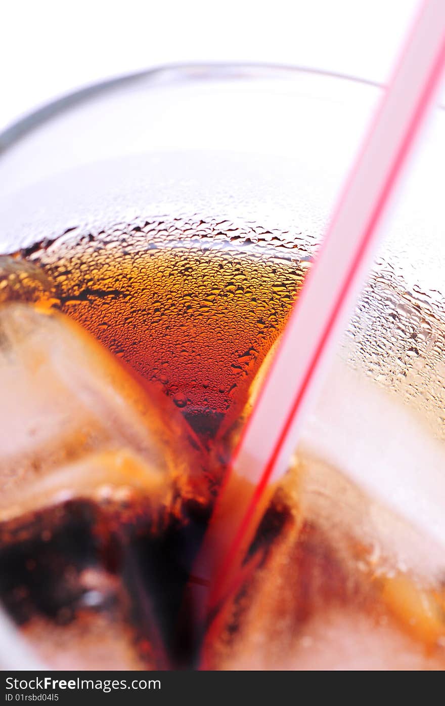 Glass of cola with ice cubes