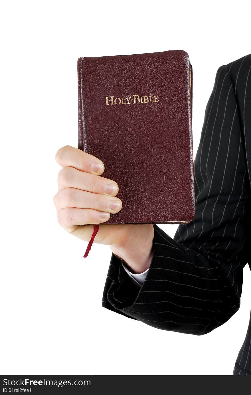 Business man holding a bible