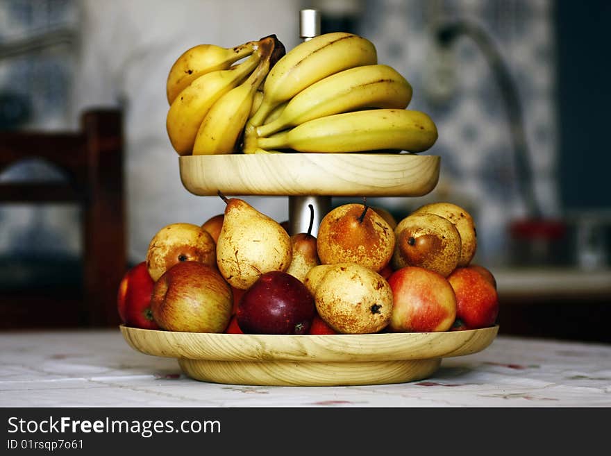 Close view of a bowl of mixed fruits, bananas, pears and apples. Close view of a bowl of mixed fruits, bananas, pears and apples.