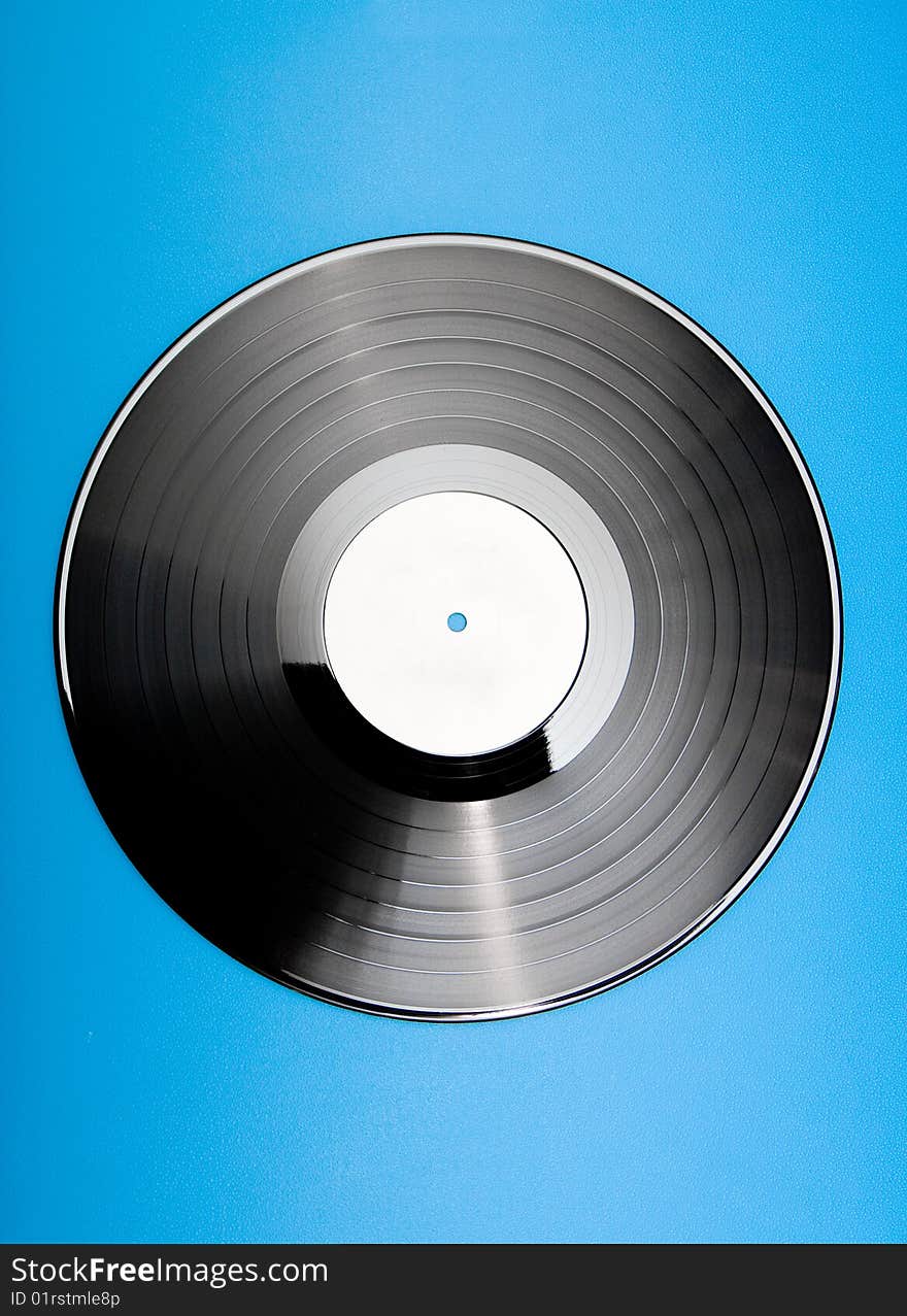 Vinyl disc on blue background