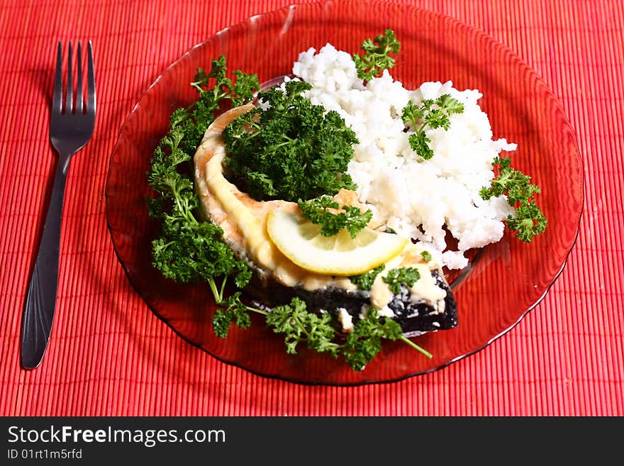 Plate with slice of salmon and rice. Plate with slice of salmon and rice