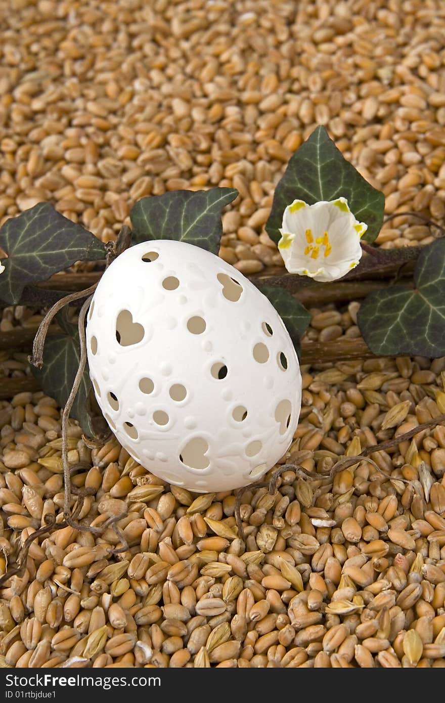 Retirement with ivy - berry and Easter egg against a background from corn. Retirement with ivy - berry and Easter egg against a background from corn.