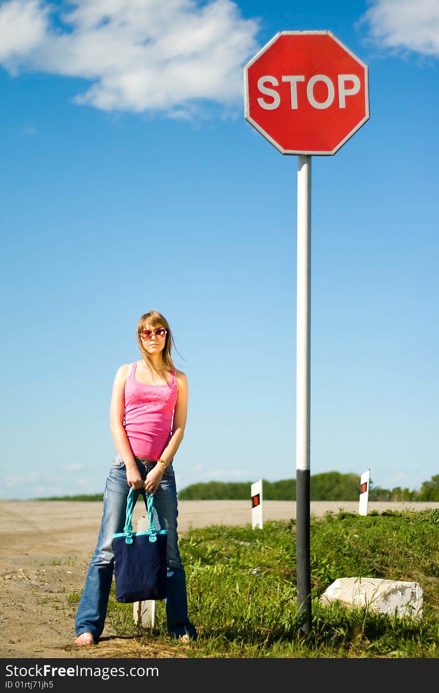 Young Woman And Stop Sign