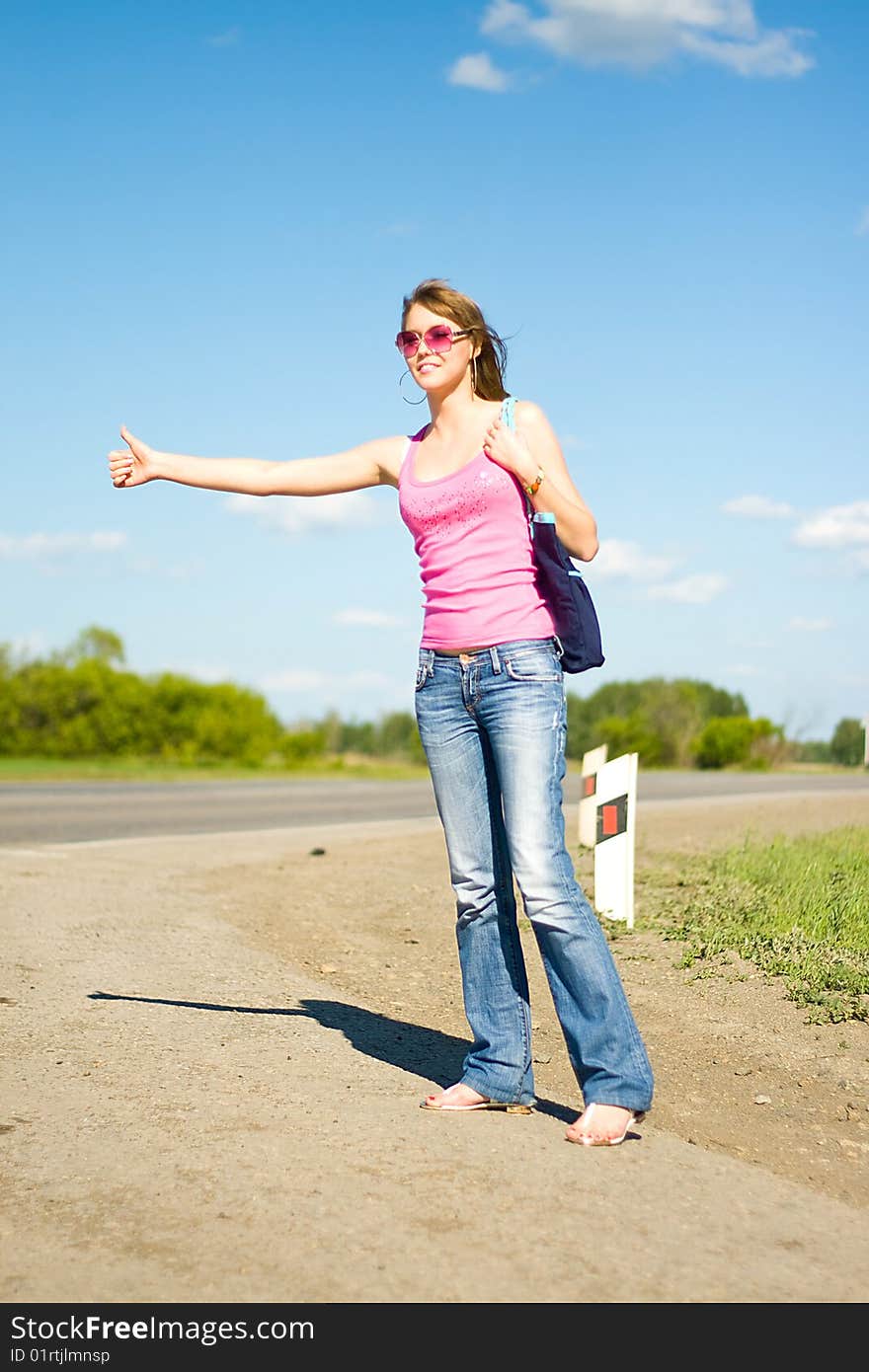 Young woman traveling by hitchhiker