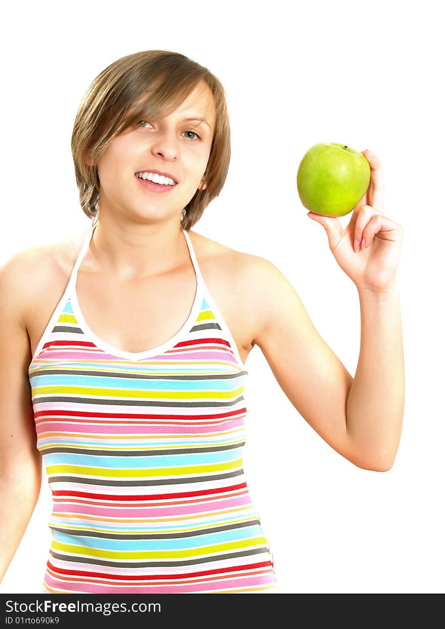 Portrait of a pretty Caucasian blond girl with a nice colorful striped dress who is smiling and she is holding a green apple in her hand. Isolated on white. Portrait of a pretty Caucasian blond girl with a nice colorful striped dress who is smiling and she is holding a green apple in her hand. Isolated on white.