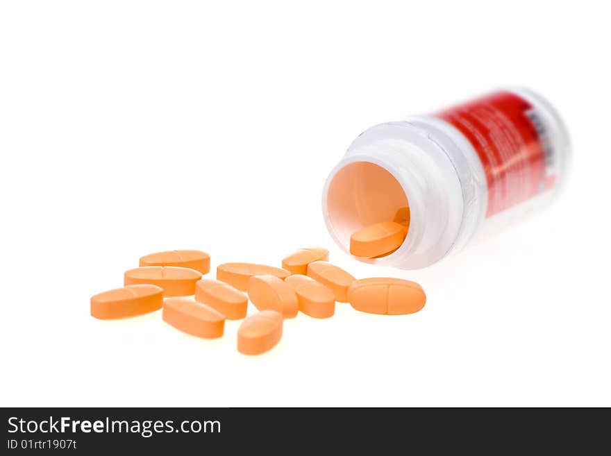 Tablets with a jar on a white background