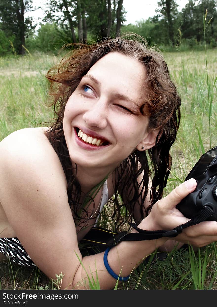 Smiling girl with photo camera