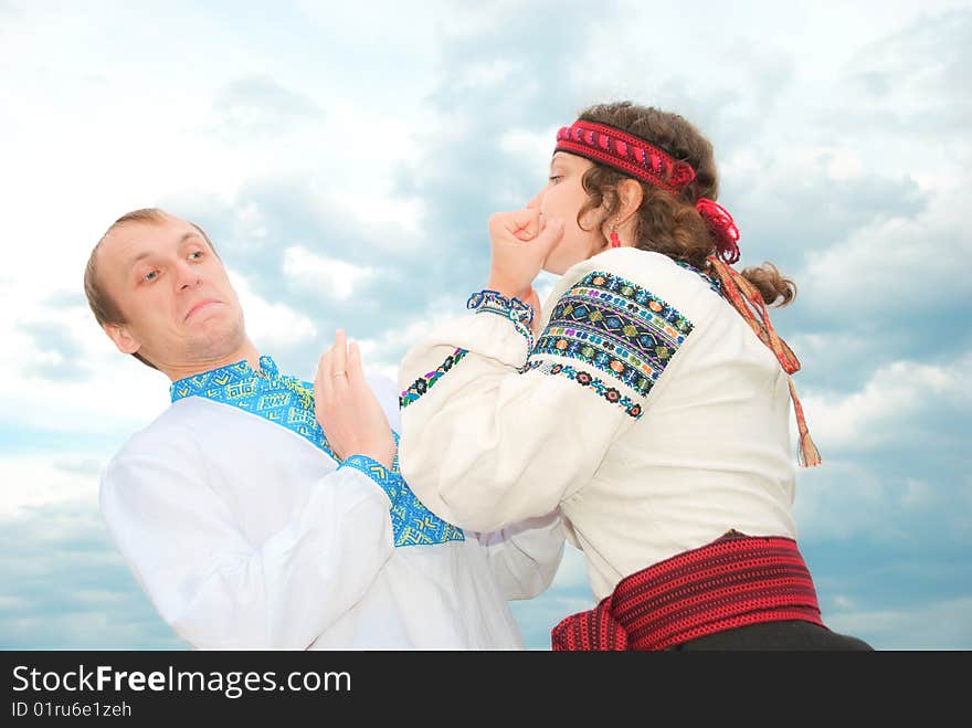 Girl showing her fists to a boy. Girl showing her fists to a boy