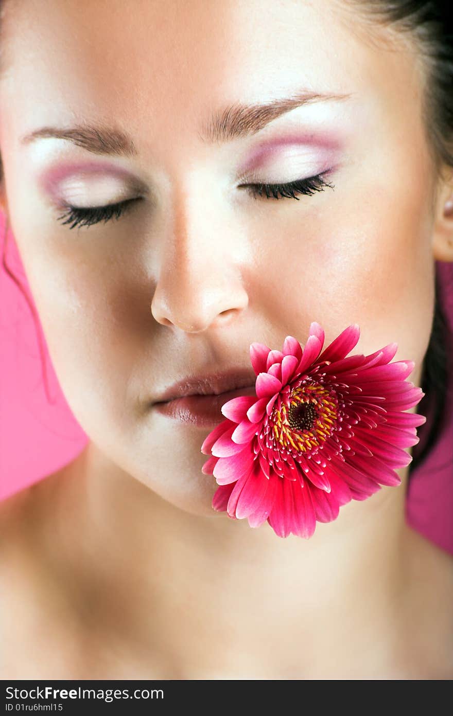 Smiling woman with a flower