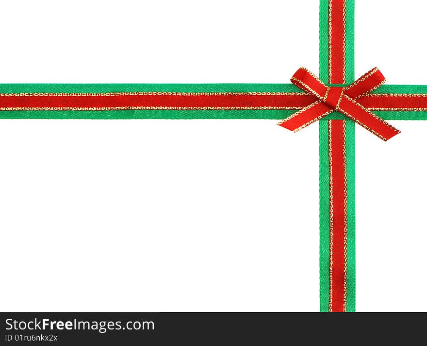 Red and green ribbon and bow isolated on white background