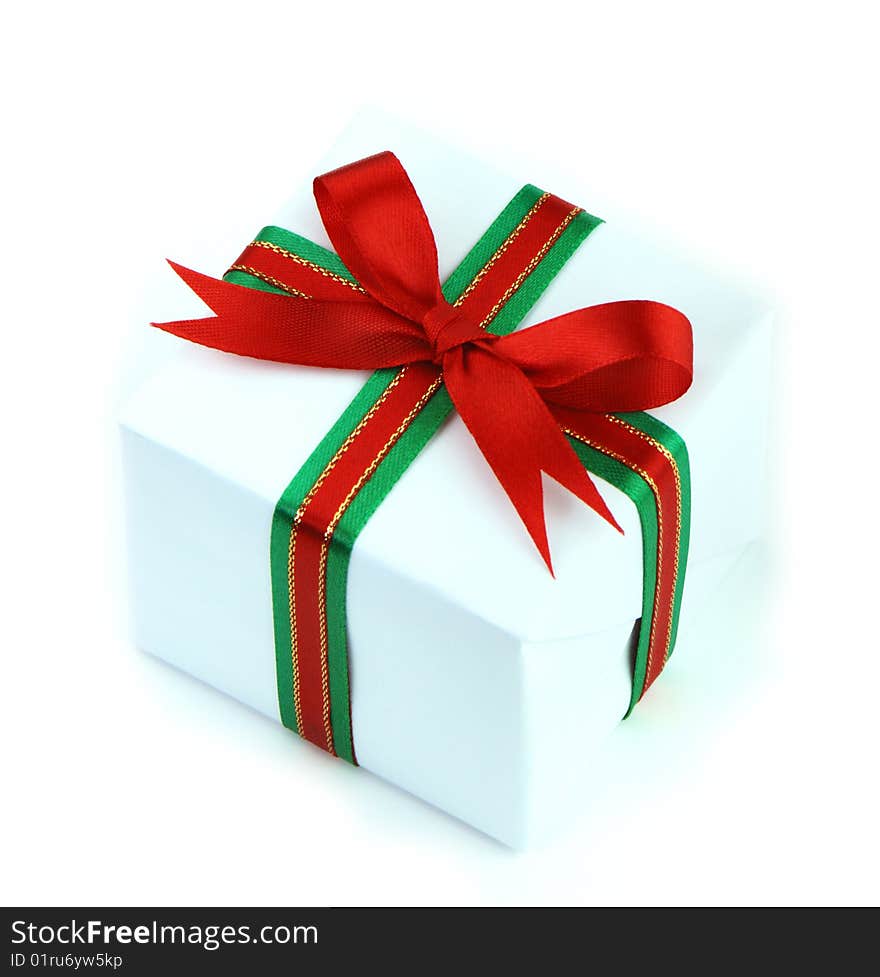 White gift box with red and green ribbon