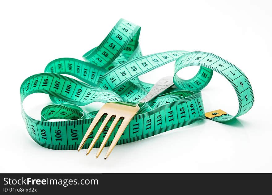 Cutlery with a measuring tape, diet, moderate eating. Cutlery with a measuring tape, diet, moderate eating