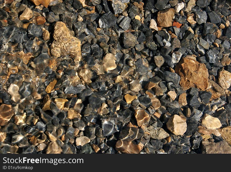 Pebbles at the bottom of river Satis, Central Russia.