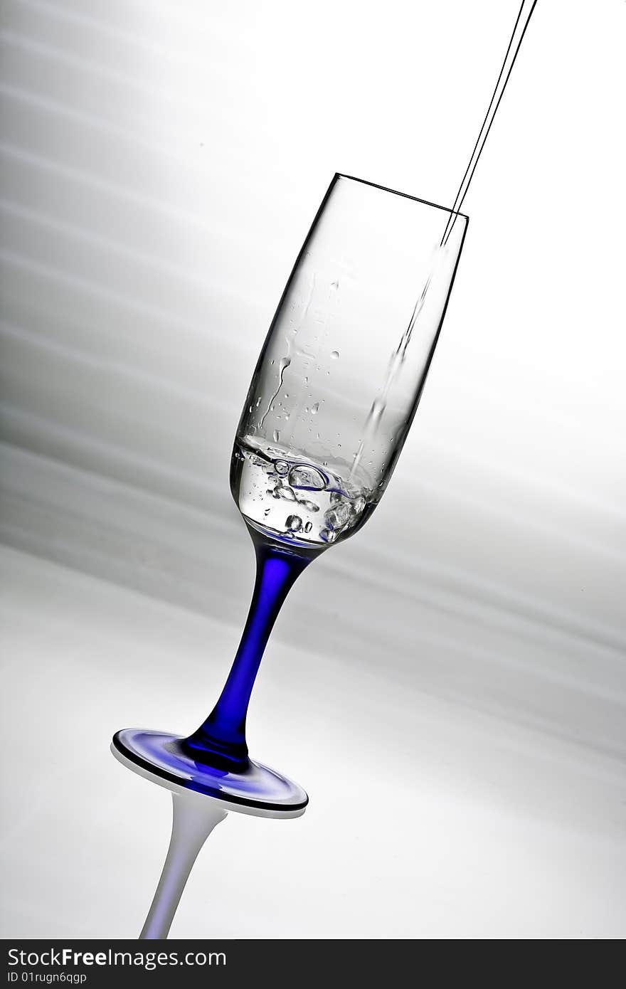 Glass with water dropped in