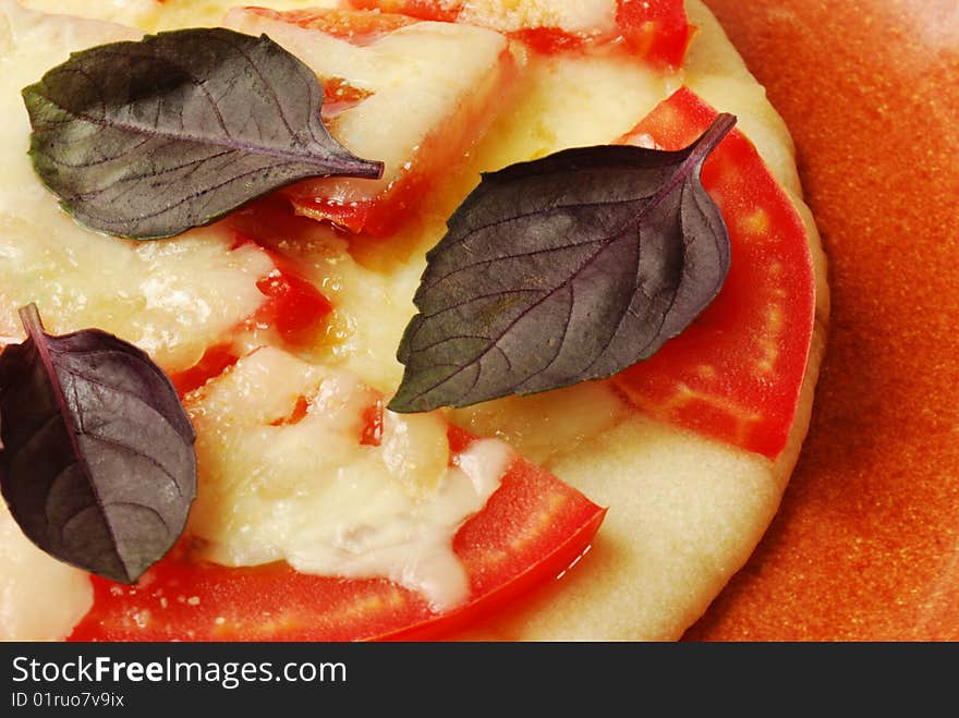 Mini neapolitana pizza on ceramic plate