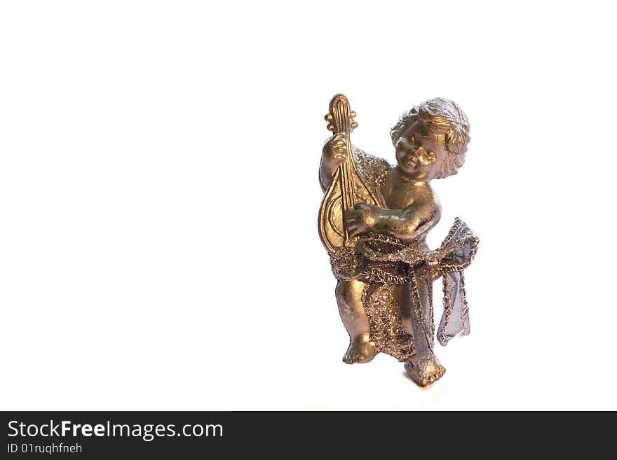 A bronze ornamental angel used for christmas decoration isolated on a white background. A bronze ornamental angel used for christmas decoration isolated on a white background