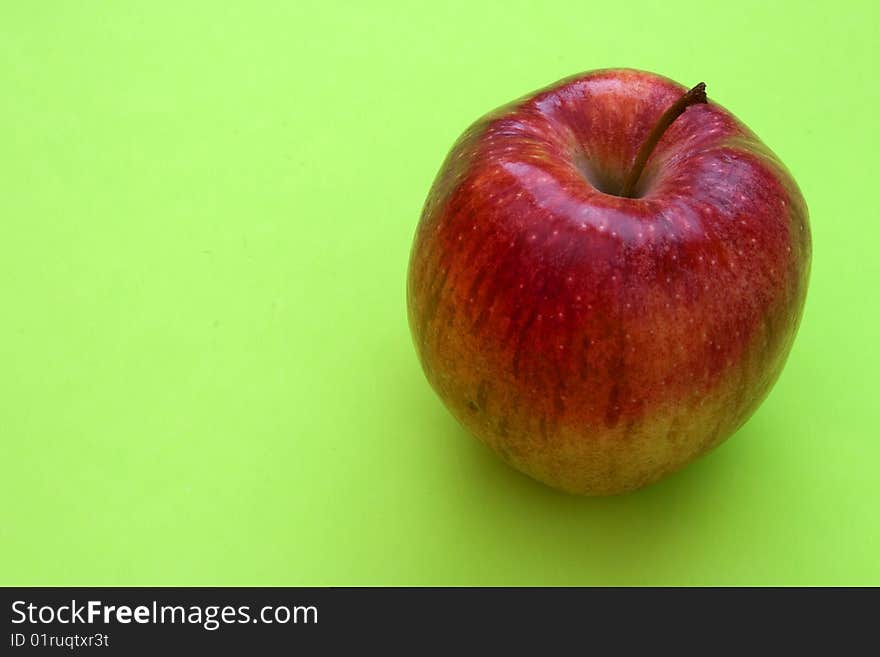 Red apple on a solid colored background. Red apple on a solid colored background