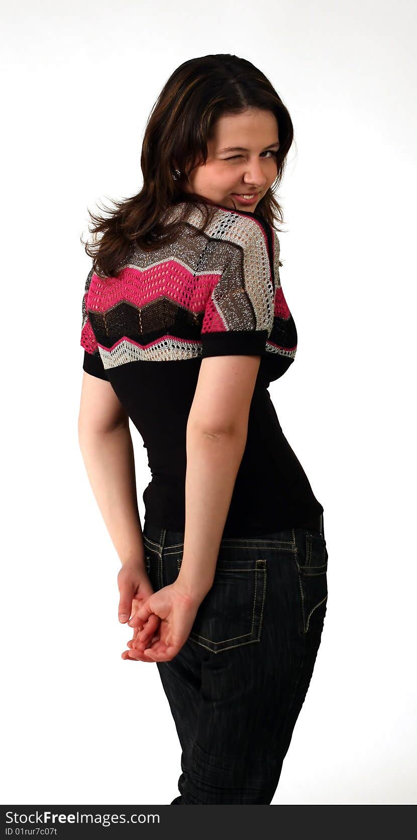 Girl blinking over her shoulder on white background. Girl blinking over her shoulder on white background