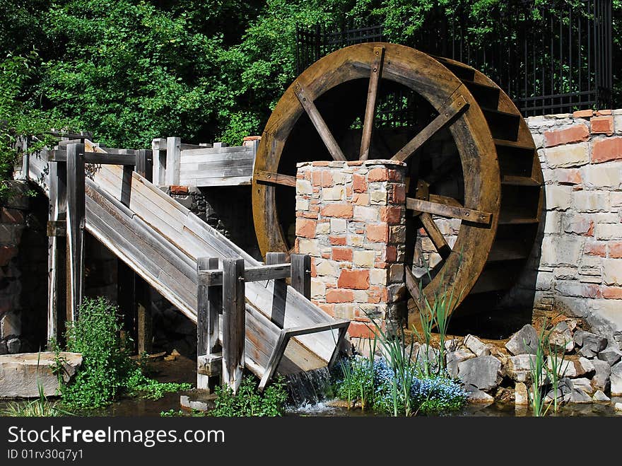 Picture of an old water wheel in a pond