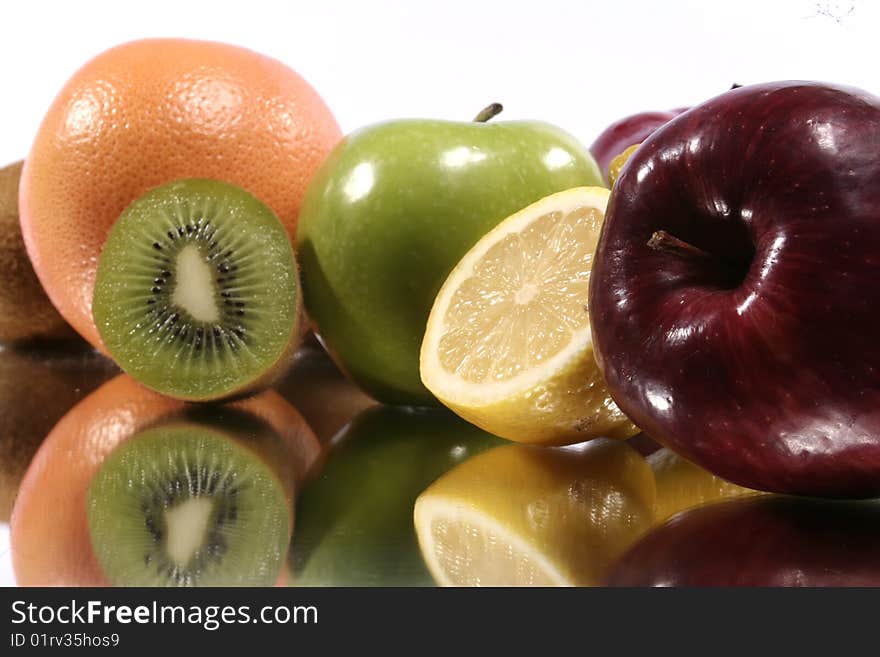 Assorted fruits with their reflection