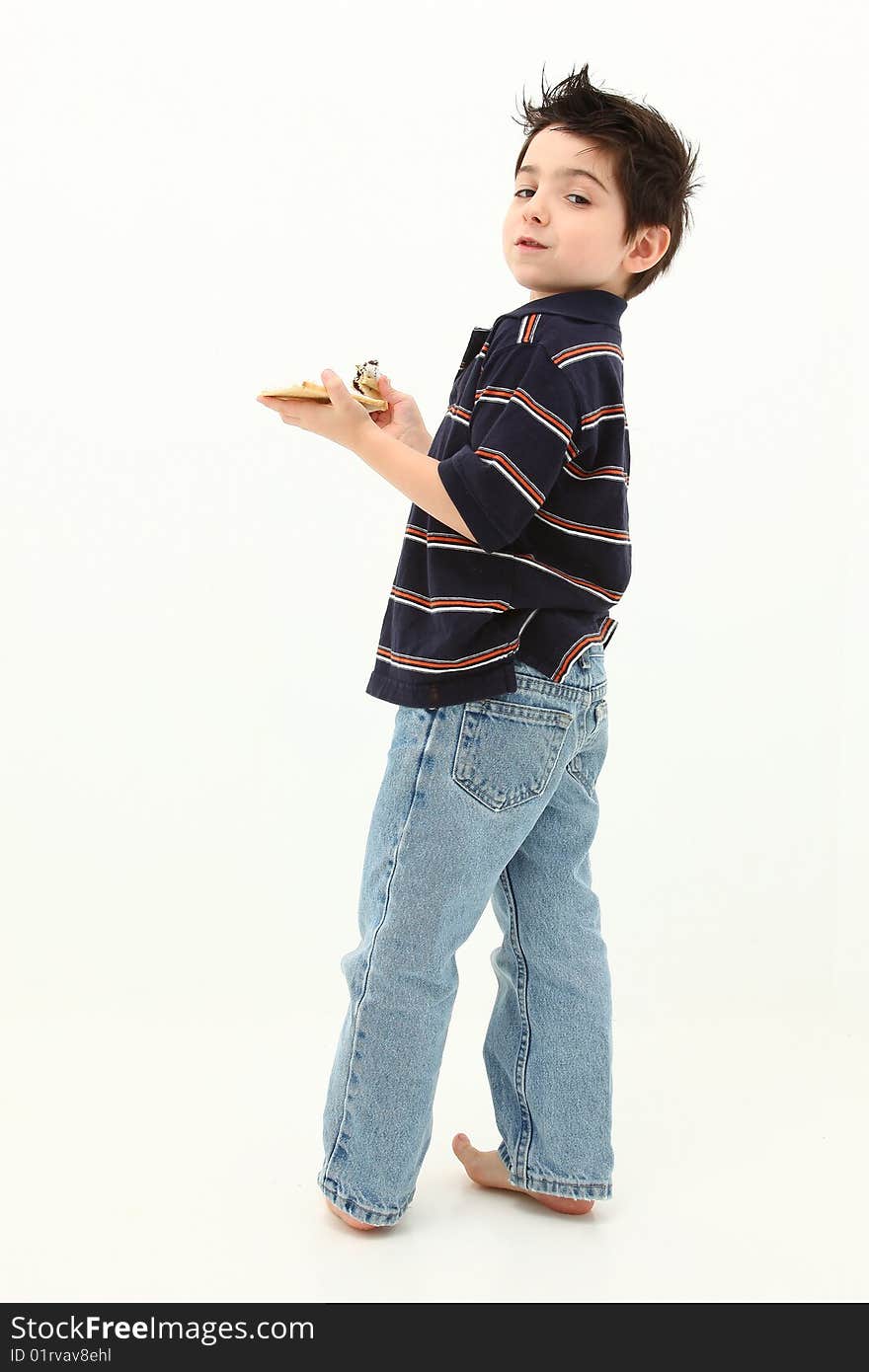 Adorable six year old boy laughing and eating pop tarts.  Sitting on white floor. Adorable six year old boy laughing and eating pop tarts.  Sitting on white floor.