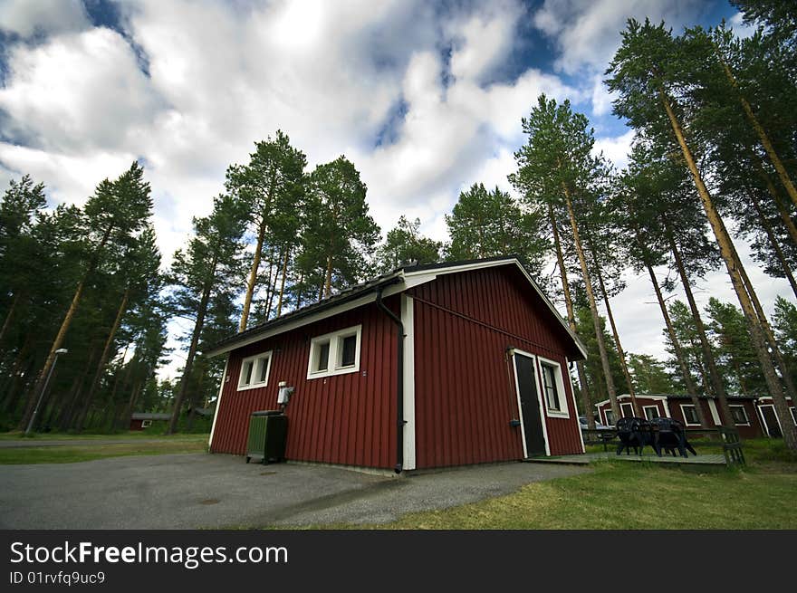A red painted wooden hut at a Swedish camp site. A red painted wooden hut at a Swedish camp site.