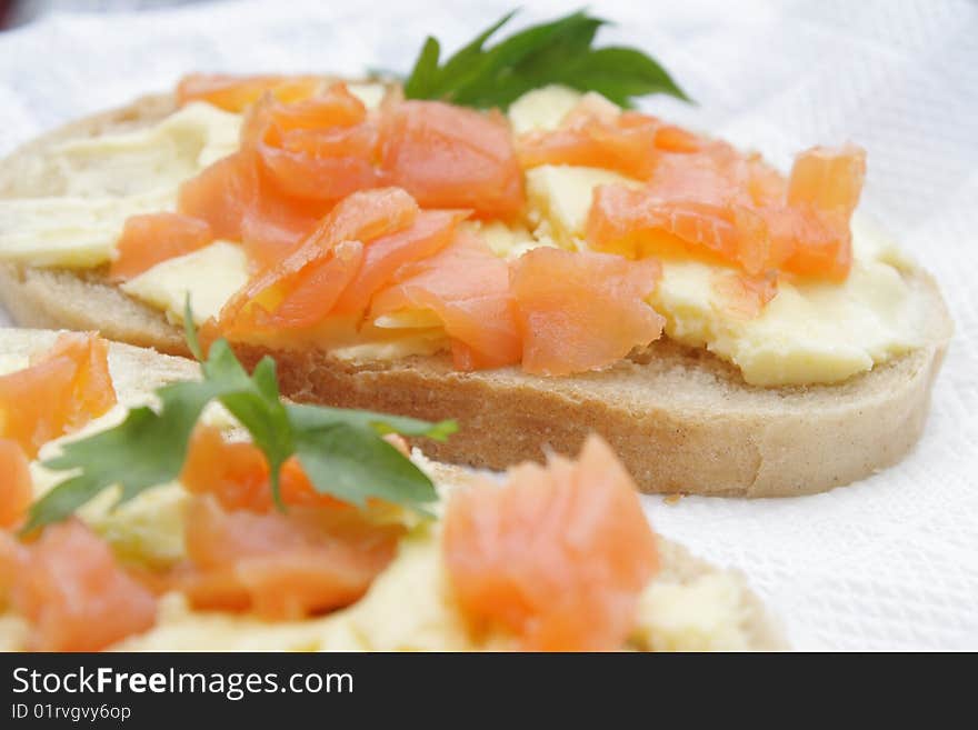 Sandwiches with a salmon, a butter and parsley. Sandwiches with a salmon, a butter and parsley.