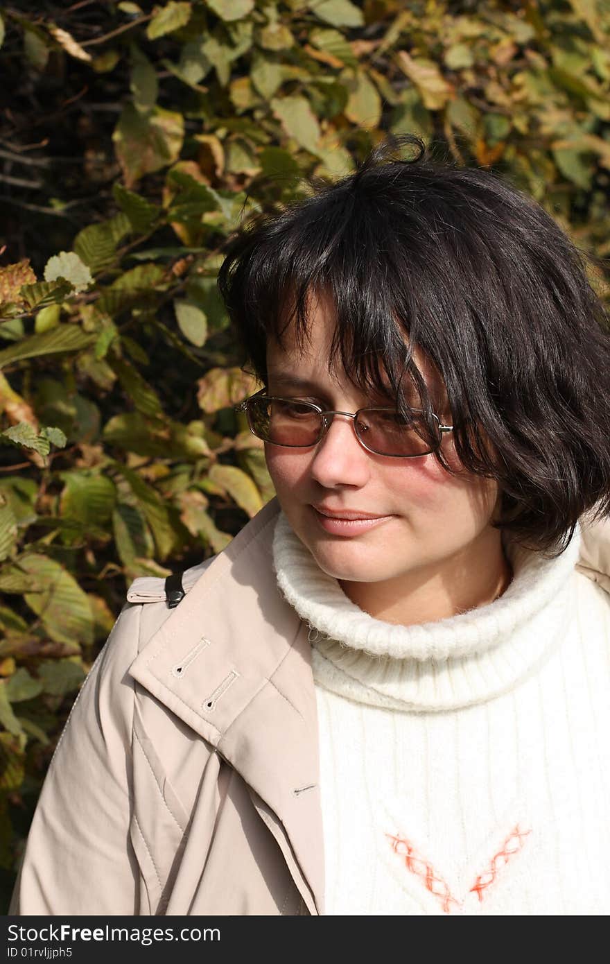 Close up of the smiling woman in glasses