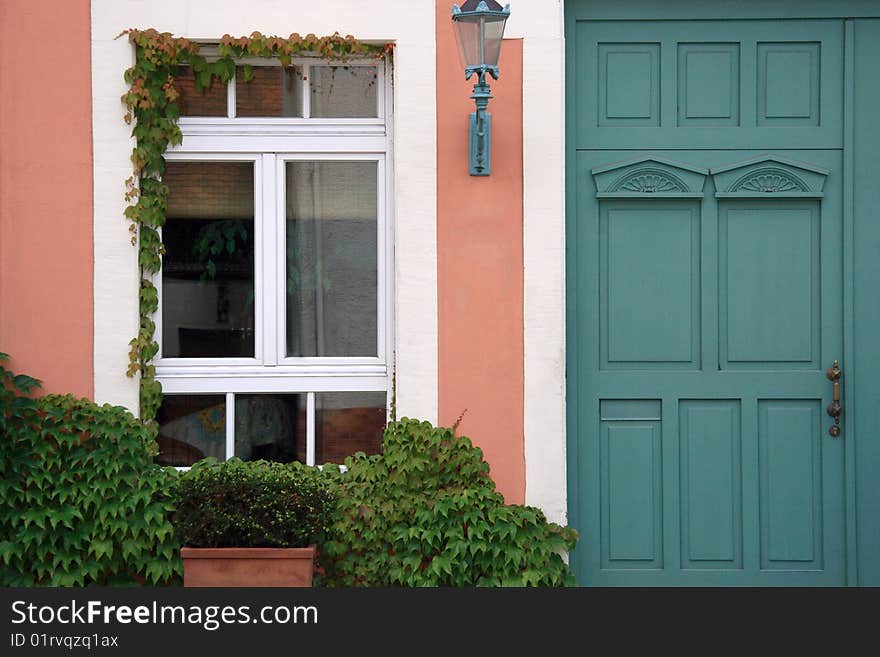 Typical cottage entrance in pastel colors. Typical cottage entrance in pastel colors