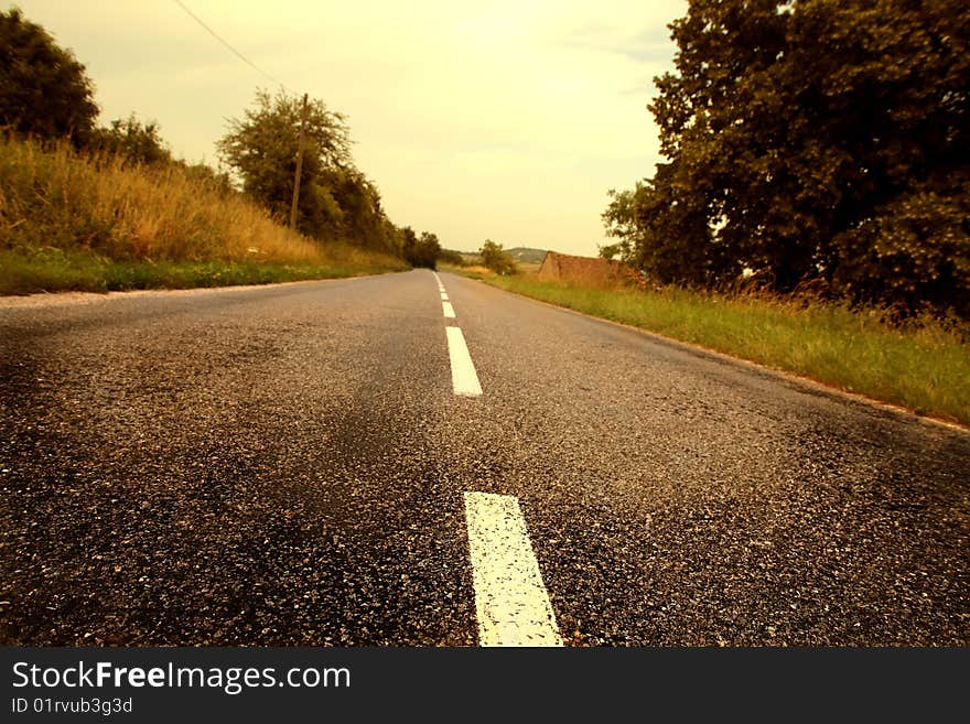 Country road at the sunset