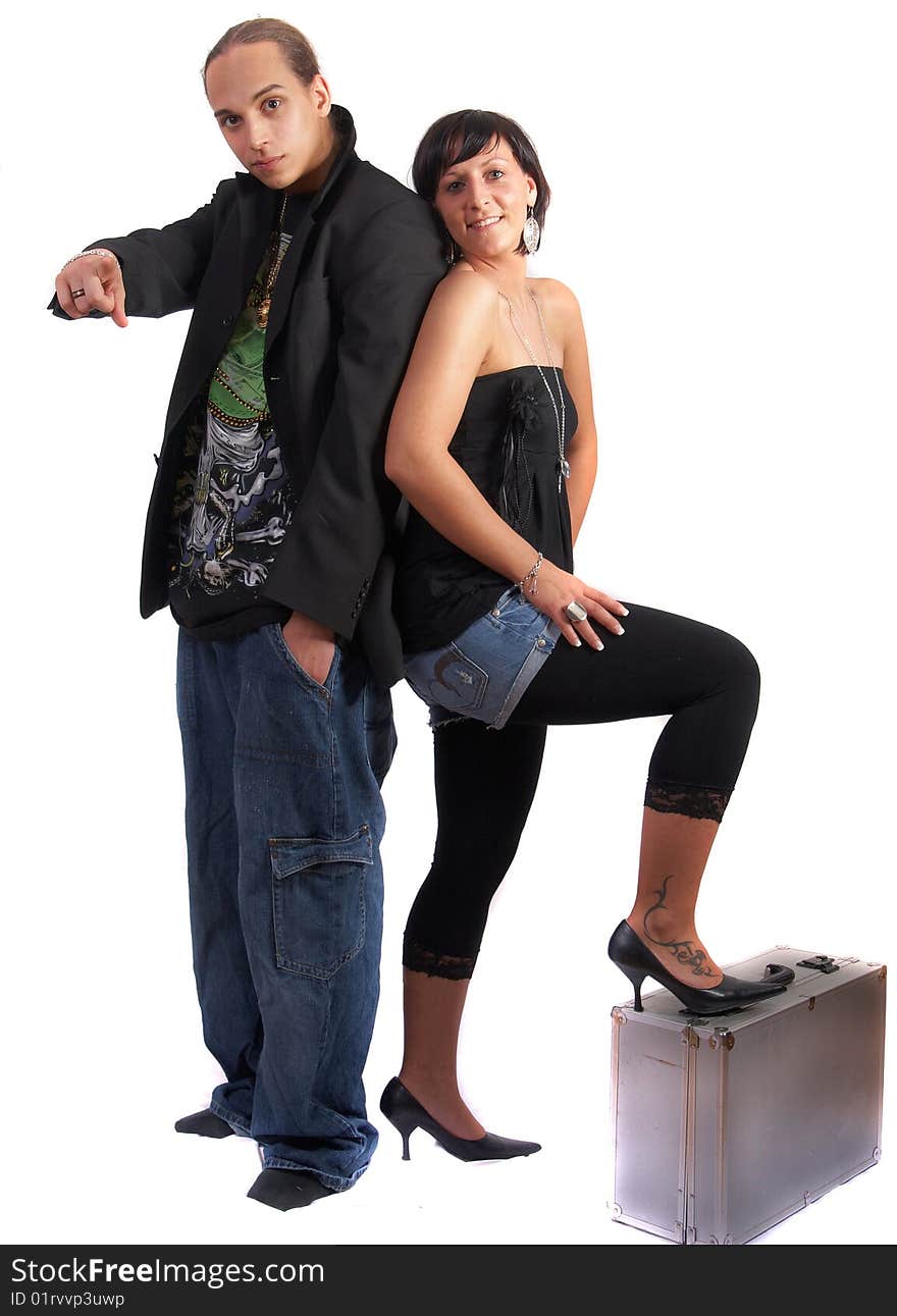 Young stylish couple isolated over white. She is standing on dj case. Young stylish couple isolated over white. She is standing on dj case.