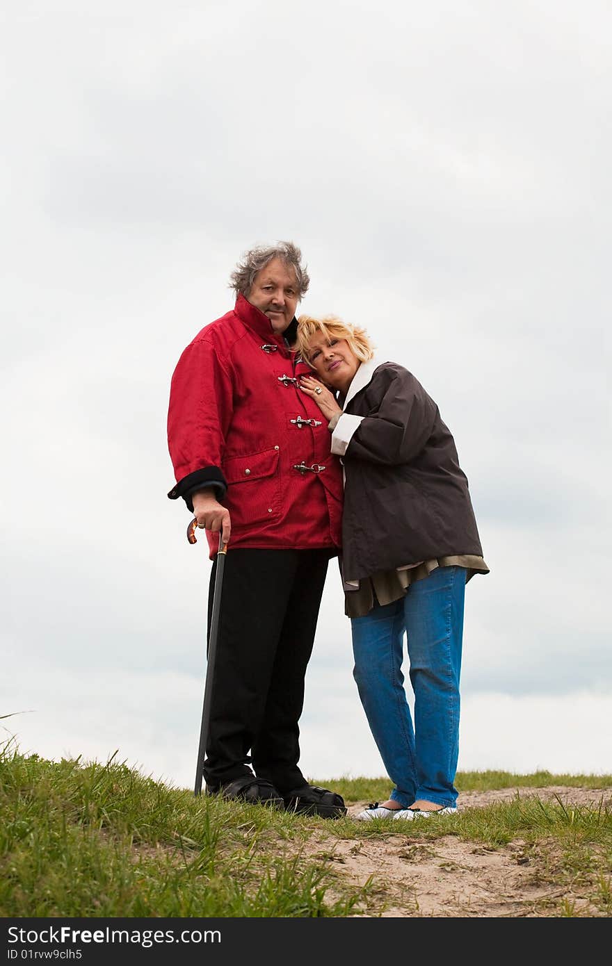 Senior woman hugging her husband isolated on white. Senior woman hugging her husband isolated on white