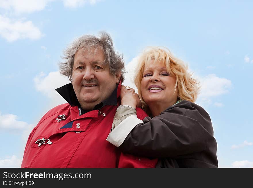 Senior woman hugging her husband isolated on white. Senior woman hugging her husband isolated on white