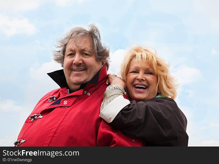 Senior woman hugging her husband isolated on white. Senior woman hugging her husband isolated on white