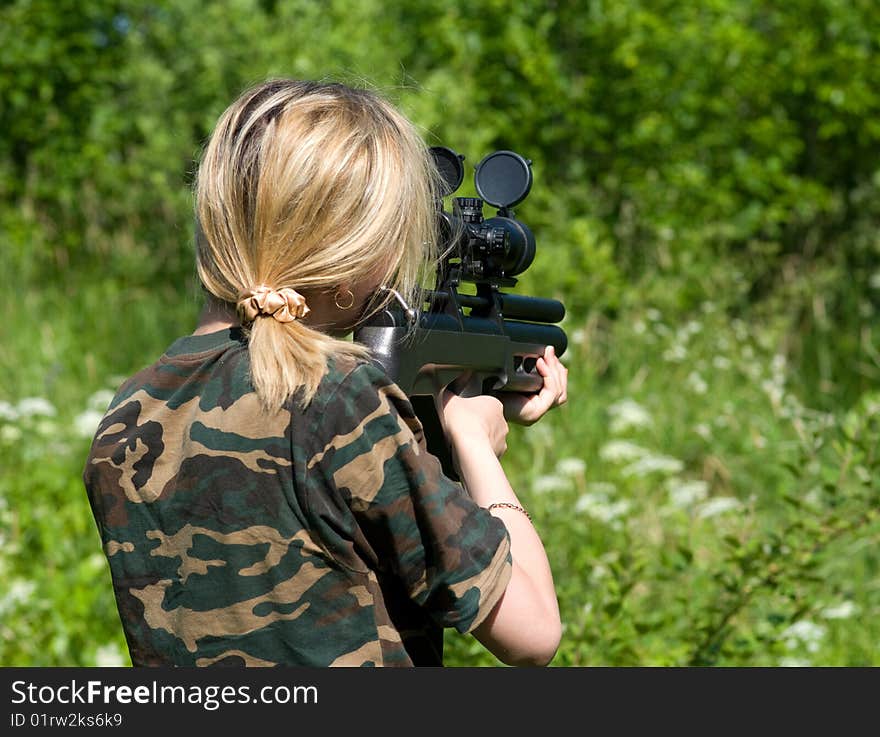 The blonde with a gun.