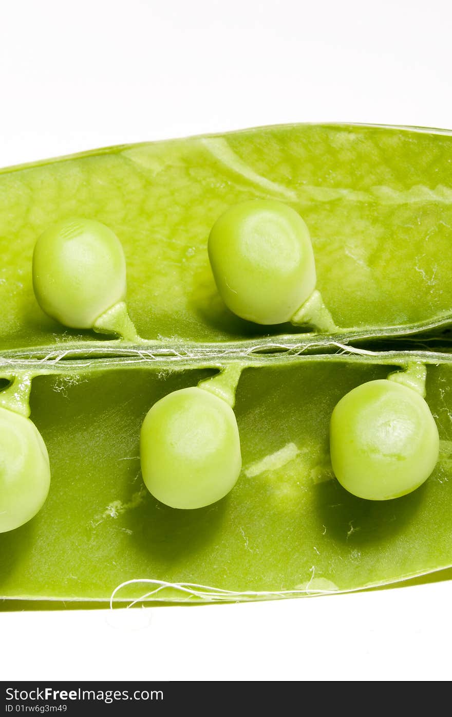 Fresh green peas isolated on white