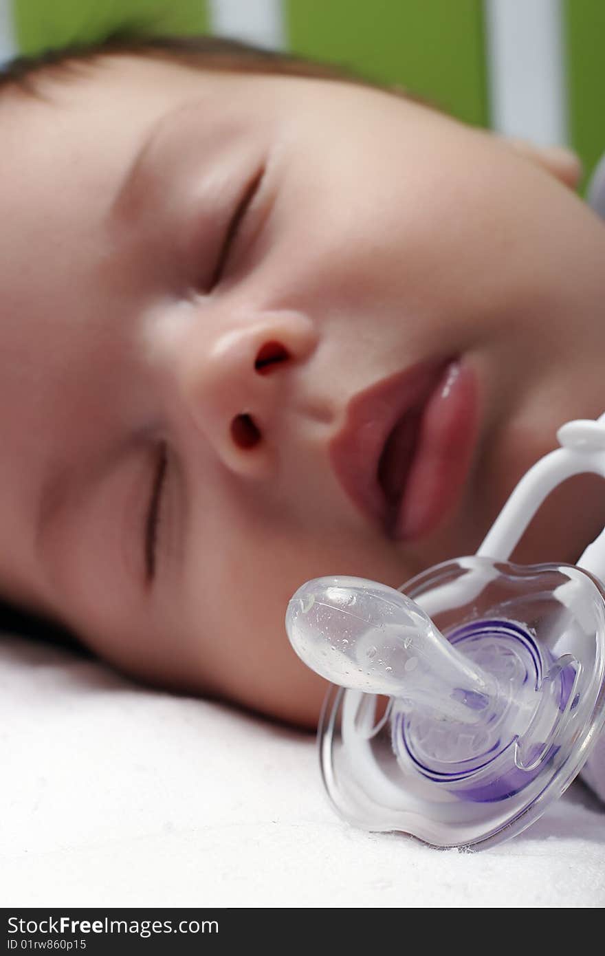 Portrait of sleeping baby with dummy closeup. Portrait of sleeping baby with dummy closeup