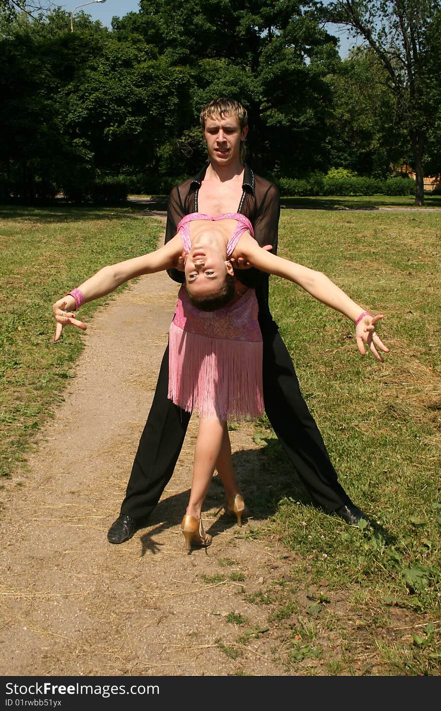 Couple dancing in a park. Couple dancing in a park